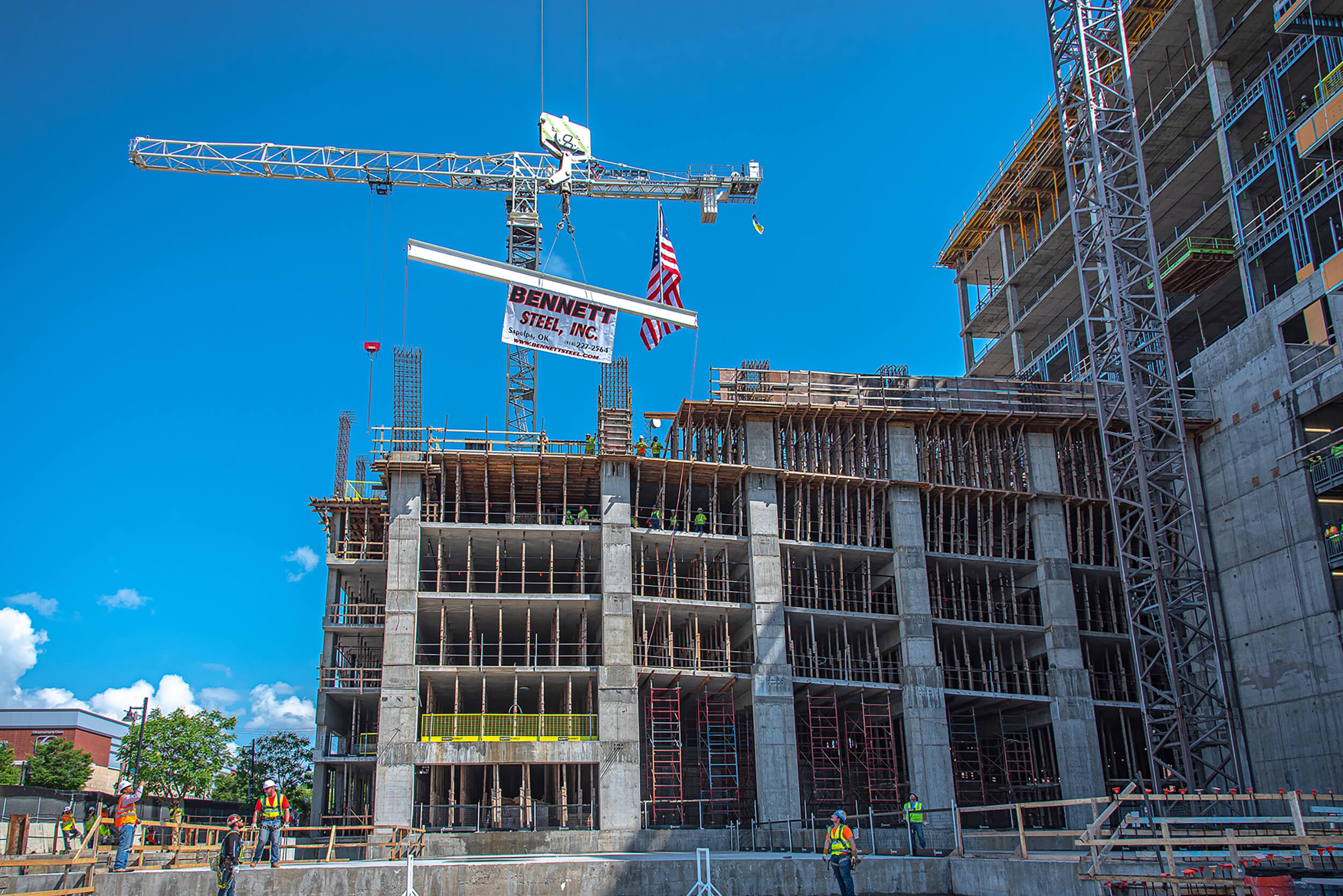 A crane operates at a building site in Tulsa, OK.