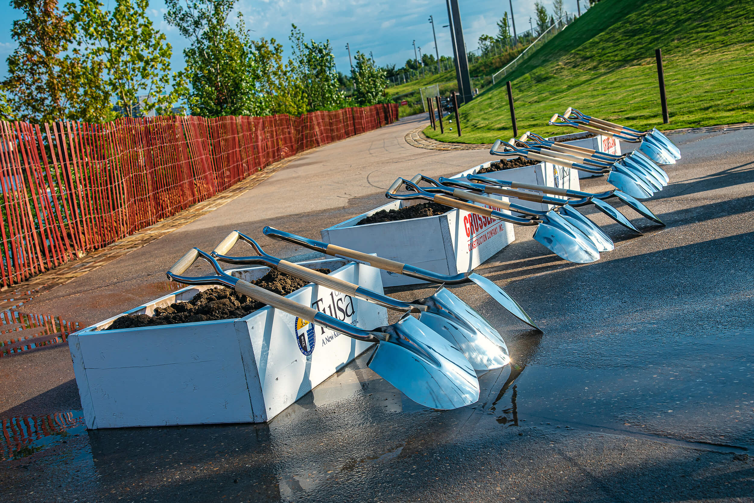 Shovels rest on rectangular planters at a dig site in Tulsa, OK.